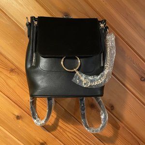 Moda Luxe with black suede trim and two side pockets